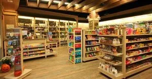 A store filled with lots of shelves and many different types of food. A store filled with lots of shelves and many different types of food.
