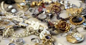 A table covered with lots of jewelry and rings. A table covered with lots of jewelry and rings.