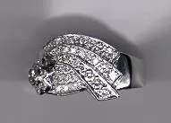 A silver ring with some kind of diamond on it
