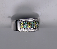 18k gold ring with green and yellow stones.