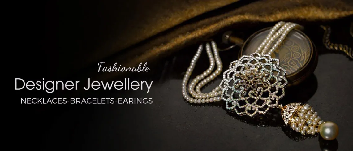 Elegant pearl necklace and intricate earrings showcased on dark fabric. Elegant pearl necklace and intricate earrings showcased on dark fabric.